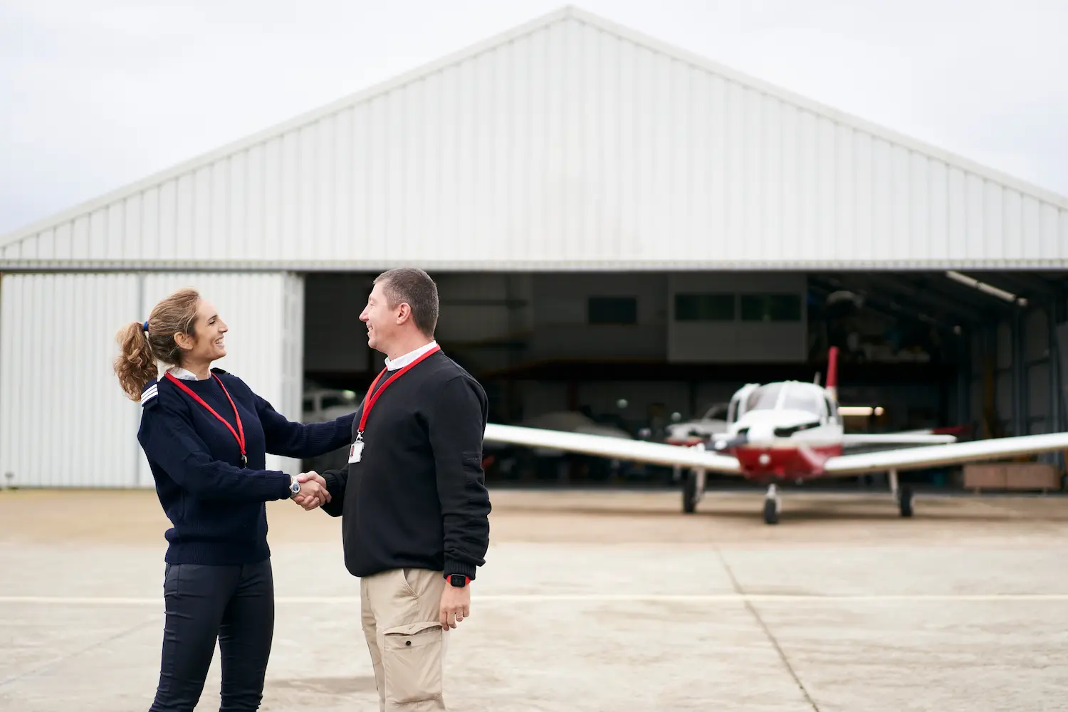 Aviation professionals beside a training aircraft — AIRAT Question Bank