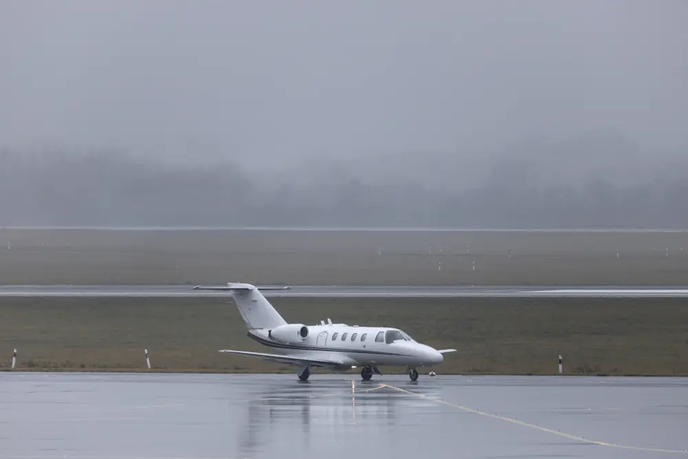 Aircraft on a wet runway in instrument conditions — FAA to Transport Canada Instrument Rating Conversion