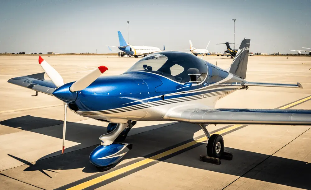 Blue single-engine aircraft on an airport ramp — FAA to Transport Canada Private Pilot Conversion