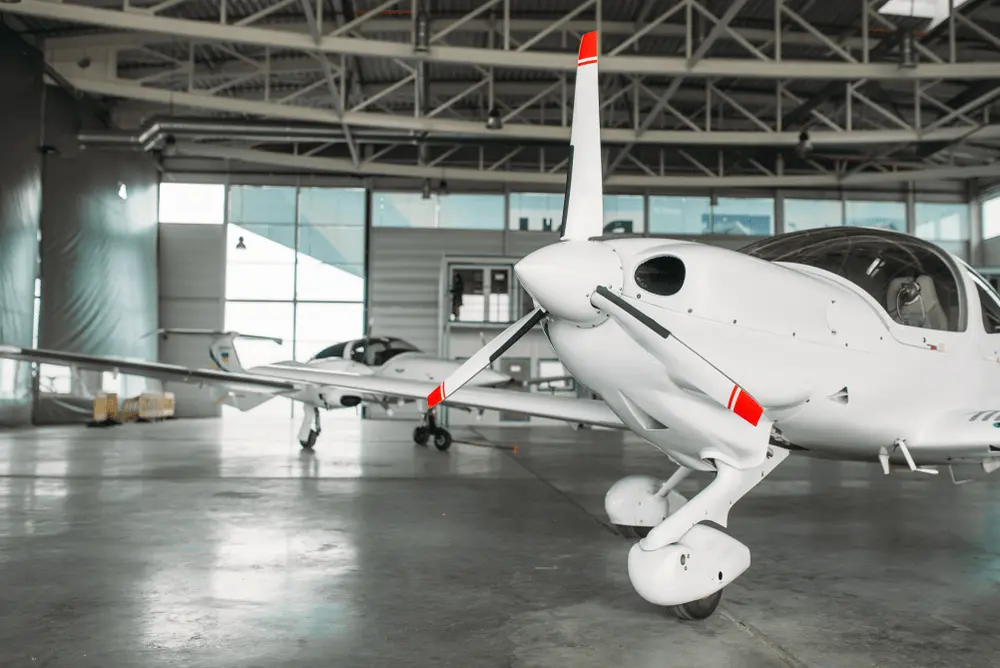 Private pilot training aircraft in a hangar — Private Pilot Flight Test Guide