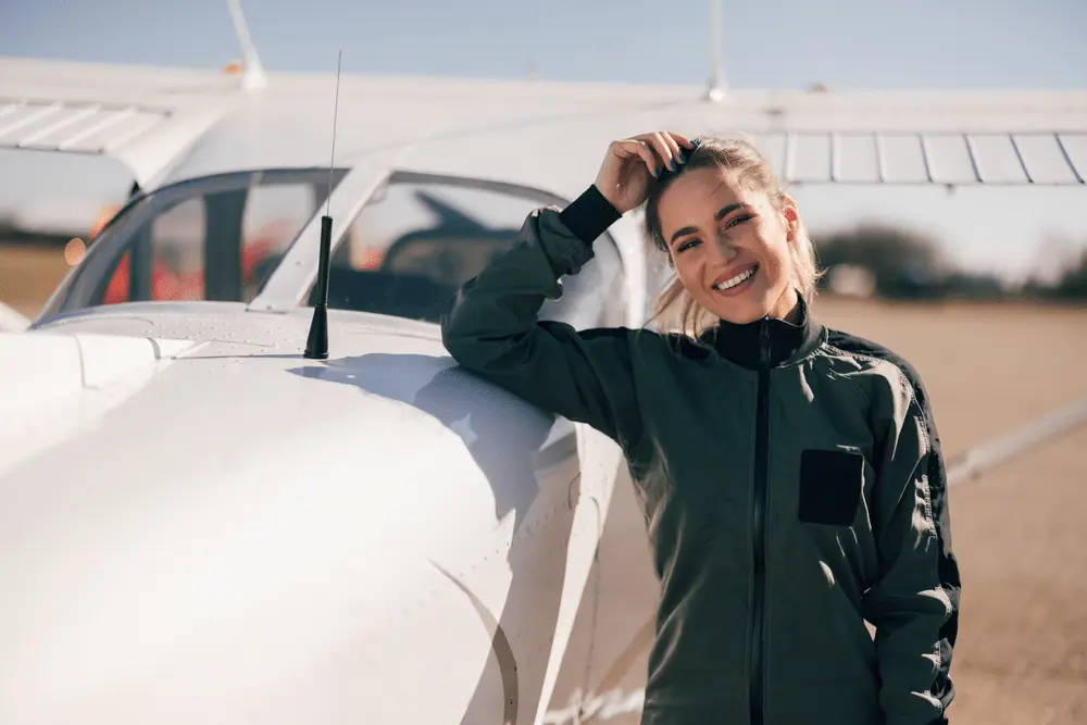 Student pilot beside a training aircraft — PSTAR Question Bank