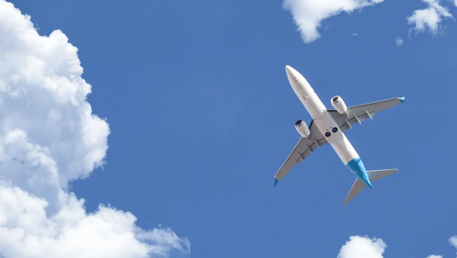 Passenger airliner flying beneath a blue sky — SAMRA Question Bank