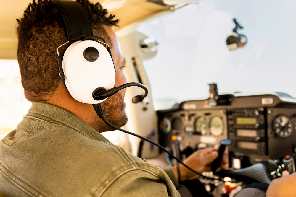 man talking on the radio in small plane
